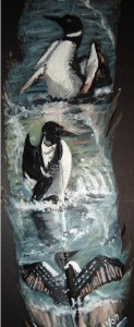 3 loons dancing painted on feather