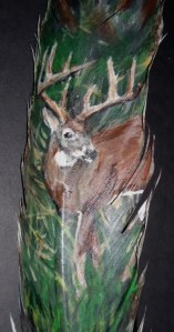 Buck in a field on feather