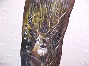 Buck in the Grass painted on feather