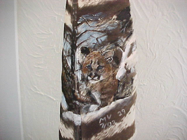 Cougar in Snow on feather