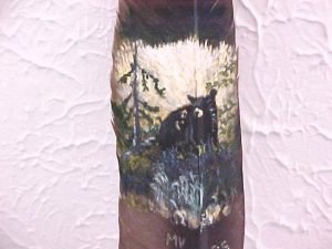 Bear in Meadow painted on feather