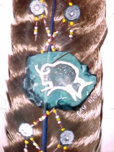Buffalo on turquoise painted on feather