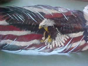 Eagle soaring with flag background on feather